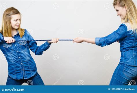 2 girls pulling a rope|Two girls pulling a safety rope next to the climbing wall Stock Video